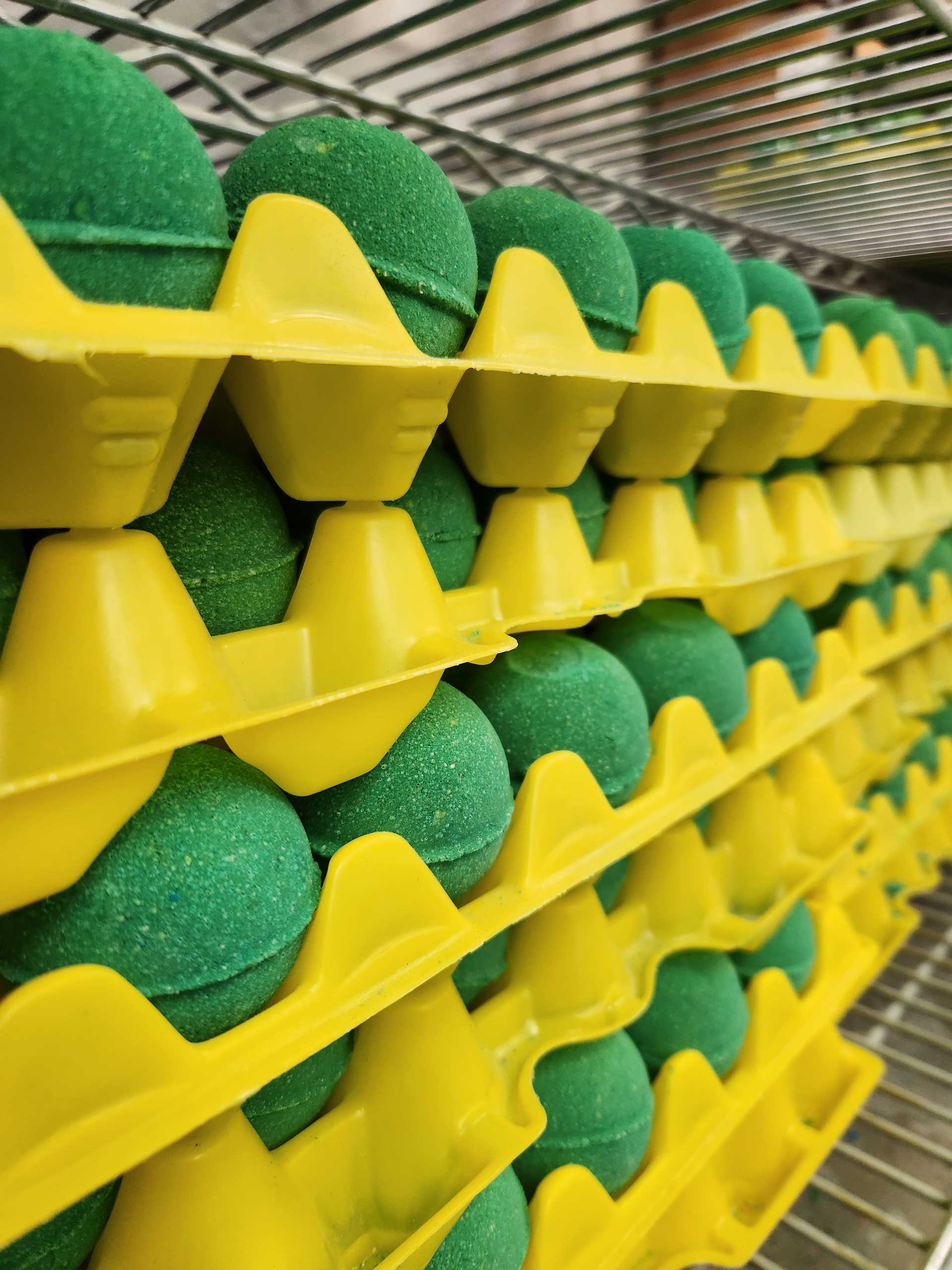 Tray of freshly made bath bombs, part of the production process.