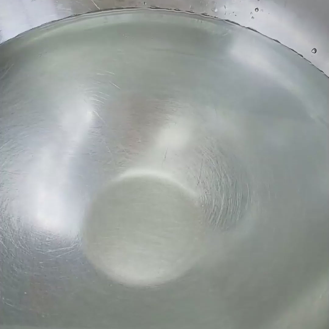Galaxy Bomb dissolving in water with gentle bubbles and colourful swirls.