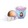 Orange and purple Galaxy Bombs bath bomb next to packaging reading 'Galaxy Bombs - Bubbling Bath Bomb'.
